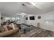 Basement Living room featuring a large sofa, tv, and game table at 411 Woodstone West Dr, Marietta, GA 30068