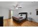 Spacious bedroom featuring a king bed, hardwood floors, and natural light at 411 Woodstone West Dr, Marietta, GA 30068