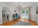 Bright office space with french doors, hardwood floors, and stylish chandelier at 411 Woodstone West Dr, Marietta, GA 30068