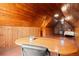 Wood paneled attic featuring a large desk, wood floors and paneled walls at 1791 Melrose Sw Dr, Atlanta, GA 30310