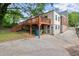 Back of house featuring a wooden deck with staircase and large backyard at 1791 Melrose Sw Dr, Atlanta, GA 30310