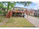 Back of house featuring a wooden deck with staircase and large backyard at 1791 Melrose Sw Dr, Atlanta, GA 30310