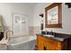 Comfortable bathroom with jacuzzi tub, dark wood accents and natural light at 1791 Melrose Sw Dr, Atlanta, GA 30310