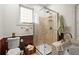 Bathroom with glass shower stall, toilet, and soaking tub at 1791 Melrose Sw Dr, Atlanta, GA 30310