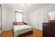 Bright bedroom features hardwood floors, a window, and neutral paint at 1791 Melrose Sw Dr, Atlanta, GA 30310