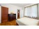Comfortable bedroom with hardwood floors, sheer curtains, and plenty of natural light at 1791 Melrose Sw Dr, Atlanta, GA 30310