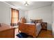 Cozy bedroom with hardwood floors, natural light and vintage furniture at 1791 Melrose Sw Dr, Atlanta, GA 30310