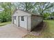 Two-car detached garage made of concrete blocks and white garage doors at 1791 Melrose Sw Dr, Atlanta, GA 30310
