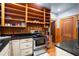 Functional kitchen features stainless steel appliances, granite counters, and wooden cabinets at 1791 Melrose Sw Dr, Atlanta, GA 30310
