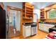 Charming kitchen features stainless steel appliances, granite counters, and wooden cabinets at 1791 Melrose Sw Dr, Atlanta, GA 30310