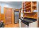 Efficient kitchen with stainless steel appliances, black countertops, and convenient storage at 1791 Melrose Sw Dr, Atlanta, GA 30310