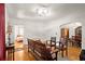 Cozy living room with hardwood floors, bench seating and dining area at 1791 Melrose Sw Dr, Atlanta, GA 30310