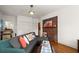 Comfortable living room with exposed brick accent wall and bright light from multiple windows at 1791 Melrose Sw Dr, Atlanta, GA 30310