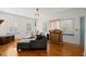 Cozy living room with white walls, hardwood floors, and lots of natural light at 1791 Melrose Sw Dr, Atlanta, GA 30310