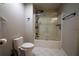 Bathroom featuring a shower with glass doors, modern fixtures, and tiled floors at 120 Clifford Ct, Canton, GA 30115