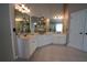 Bathroom vanity with double sinks, tile floors, and ample storage space at 120 Clifford Ct, Canton, GA 30115