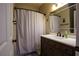 Bathroom featuring vanity with decorative mirror and shower with curtain at 120 Clifford Ct, Canton, GA 30115