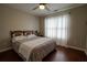 Bedroom featuring hardwood floors and natural light from large window at 120 Clifford Ct, Canton, GA 30115