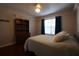 Bedroom with hardwood floors, built-in shelving, and bright natural light at 120 Clifford Ct, Canton, GA 30115