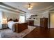 Spacious primary bedroom with hardwood floors, ceiling fan, and natural light at 120 Clifford Ct, Canton, GA 30115