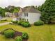 Lovely home with manicured shrubs and a green lawn at 120 Clifford Ct, Canton, GA 30115