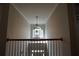 Entry foyer with chandelier and view of front door from the second floor at 120 Clifford Ct, Canton, GA 30115