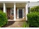 Inviting front porch with stone accents, pillars, and comfortable seating at 120 Clifford Ct, Canton, GA 30115
