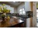 Kitchen area featuring stainless steel appliances, tile backsplash, and a dark wood island at 120 Clifford Ct, Canton, GA 30115
