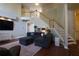 Spacious living room with staircase, hardwood floors, and open floor plan at 120 Clifford Ct, Canton, GA 30115