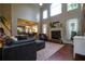 Spacious living room with tall ceilings, fireplace, open to the kitchen and hardwood floors at 120 Clifford Ct, Canton, GA 30115