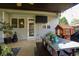 Covered patio features outdoor seating, a dining table, and a mounted TV for relaxed entertainment at 120 Clifford Ct, Canton, GA 30115