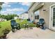 Backyard patio with chairs and a view of the grassy lawn at 4015 Soaring Dr, Douglasville, GA 30135