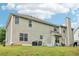 The home's backyard features a grassy area and the back of the house at 4015 Soaring Dr, Douglasville, GA 30135