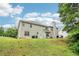 View of the backyard featuring a lush lawn and the back of the home at 4015 Soaring Dr, Douglasville, GA 30135