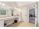 Spacious primary bathroom with vanity, granite counters, and tile flooring at 4015 Soaring Dr, Douglasville, GA 30135
