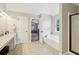 Primary bathroom showcasing soaking tub and adjoining doorways at 4015 Soaring Dr, Douglasville, GA 30135