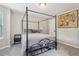 A serene bedroom with a canopy bed, neutral decor, and soft carpet at 4015 Soaring Dr, Douglasville, GA 30135