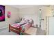 Bright bedroom with comfortable bed, soft lighting, and doorway to hall at 4015 Soaring Dr, Douglasville, GA 30135
