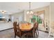 Dining room with a classic wooden table, view to living room at 4015 Soaring Dr, Douglasville, GA 30135