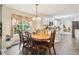 Dining room with vintage furniture set next to an open kitchen at 4015 Soaring Dr, Douglasville, GA 30135