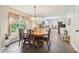 Dining room with wooden table, decorative chairs, and backyard view at 4015 Soaring Dr, Douglasville, GA 30135