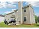 The rear exterior view highlights a patio and green space at 4015 Soaring Dr, Douglasville, GA 30135