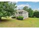 Well-maintained two-story home with a manicured lawn and mature trees at 4015 Soaring Dr, Douglasville, GA 30135