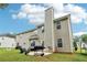 The exterior showcases a grill, patio, and grassy backyard at 4015 Soaring Dr, Douglasville, GA 30135