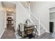 Entryway with staircase, light gray walls, and view into the kitchen at 4015 Soaring Dr, Douglasville, GA 30135