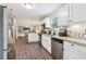 Bright kitchen features stainless steel appliances, granite countertops, and modern white cabinetry at 4015 Soaring Dr, Douglasville, GA 30135