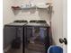 Well-equipped laundry room with modern washer and dryer set and storage at 4015 Soaring Dr, Douglasville, GA 30135