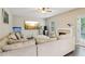 Inviting living room with a fireplace, a large sectional sofa, and plenty of natural light at 4015 Soaring Dr, Douglasville, GA 30135