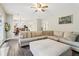 Spacious living room featuring a comfortable sectional sofa and open layout at 4015 Soaring Dr, Douglasville, GA 30135