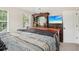 This main bedroom has a large dresser with mirror and bright window at 4015 Soaring Dr, Douglasville, GA 30135